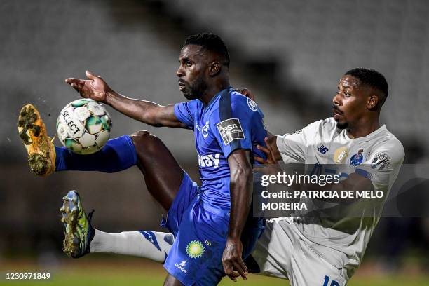 Porto's Portuguese defender Wilson Manafa challenges Belenenses' Portuguese forward Silvestre Varela during the Portuguese League football match...