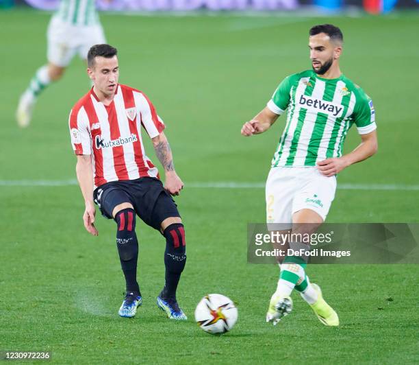 Martin Montoya of Real Betis Balompie and Alejandro Berenguer Remiro of Athletic Club battle for the ball during the Copa del Rey match between Real...