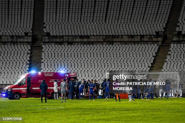 An ambulance enters the pitch as Porto's medical staff assist Porto's Bissau Guinean defender Nanu after resulting injured during the Portuguese...