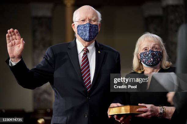 Sen. Patrick Leahy participates in a ceremonial swearing in photo op with his wife Marcelle Pomerleau and Vice President Kamala Harris in the Old...