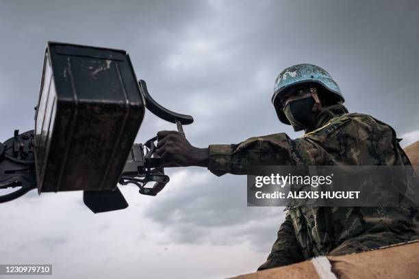 Rwandan peacekeeper from the United Nations Multidimensional Integrated Stabilization Mission in the Central African Republic patrols in Bangassou on...