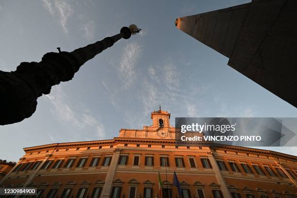 General view shows the Palazzo Montecitorio, seat of the lower house of parliament, on February 5, 2021 in Rome. - Italy's Mario Draghi continued...