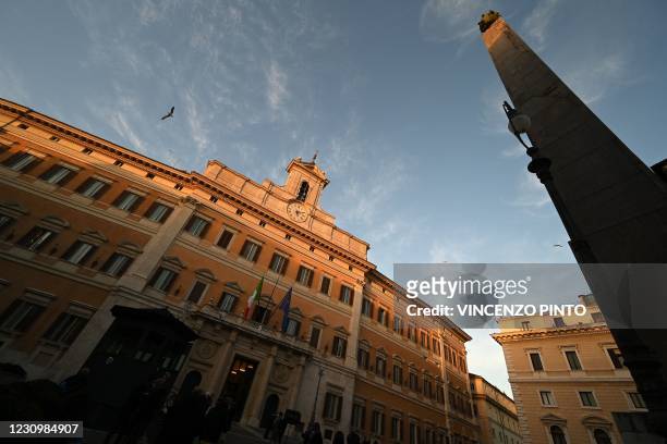 General view shows the Palazzo Montecitorio, seat of the lower house of parliament, on February 5, 2021 in Rome. - Italy's Mario Draghi continued...