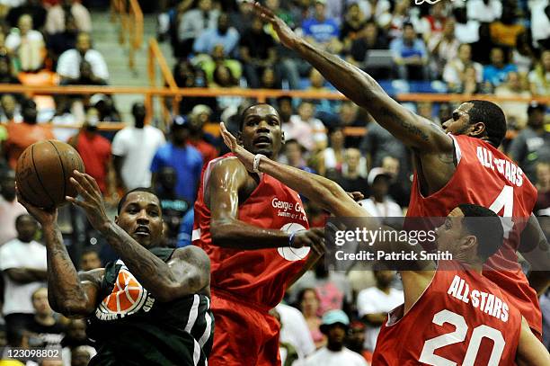 Carmelo Anthony looks for an open teammate during the Goodman League All-Stars taking on The Melo League basketball game at Edward P. Hurt Gymnasium...
