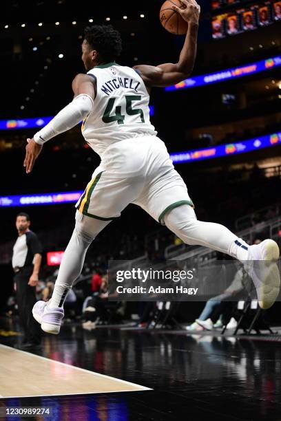 Donovan Mitchell of the Utah Jazz saves the ball against the Atlanta Hawks on February 4, 2021 at State Farm Arena in Atlanta, Georgia. NOTE TO USER:...