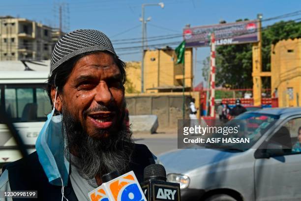 Sheikh Aslam, brother of Sheikh Adil, one of the accused of murdering US journalist Daniel Pearl, speaks with media representatives outside the...