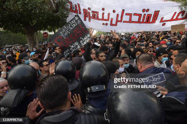 Members of the Tunisian police confront protesters demonstrating against the government and police repression in the capital Tunis on February 6 at a...