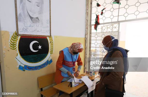 Libyan woman arrives to cast her vote to elect Tripoli Municipal Council in Tripoli, Libya on February 06, 2021. Libyas Central Commission of...