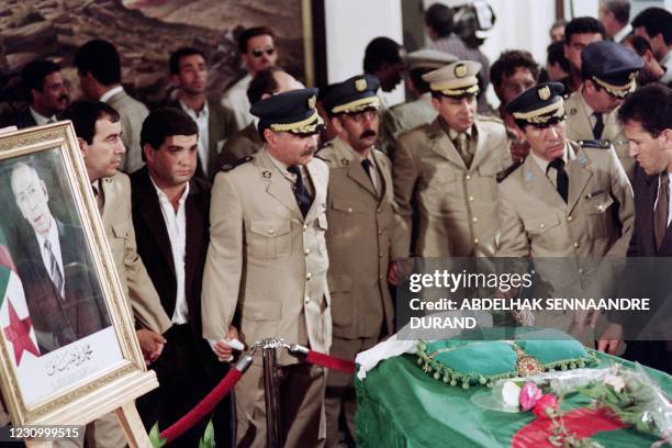 Algerian soldiers are in front of the coffin of Algerian President Mohamed Boudiaf on July 01, 1992 in Algiers. Boudiaf was shot down on June 29,...