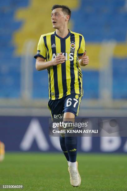 Fenerbahce's German midfielder Mesut Ozil runs during the Turkish Super League football match between Fenerbahce S.K. And Galatasaray S.K. At The...