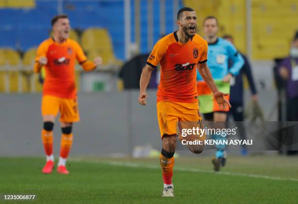 Galatasaray's Moroccan midfielder Younes Belhanda reacts after winning the Turkish Super League football match between Fenerbahce S.K. And...