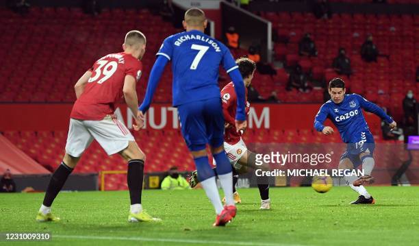 Everton's Colombian midfielder James Rodriguez scores his team's second goal during the English Premier League football match between Manchester...