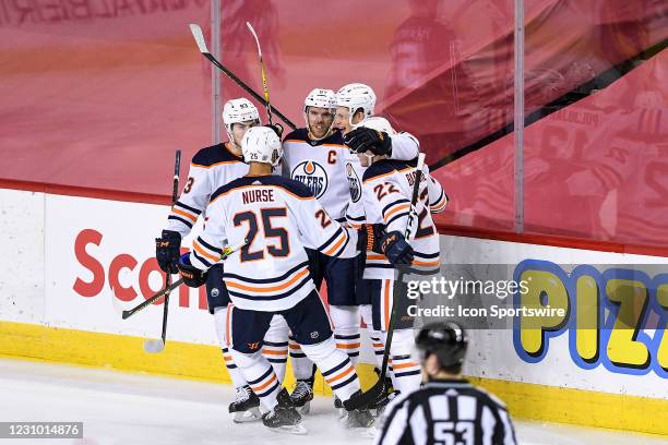 Edmonton Oilers Right Wing Jesse Puljujarvi celebrates a goal against the Calgary Flames with Edmonton Oilers Center Connor McDavid , Edmonton Oilers...