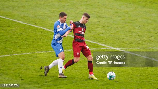 Fabian Schnellhardt of SV Darmstadt 98 and Tom Krauss of 1. FC Nuernberg during the Second Bundesliga match between SV Darmstadt 98 and 1. FC...