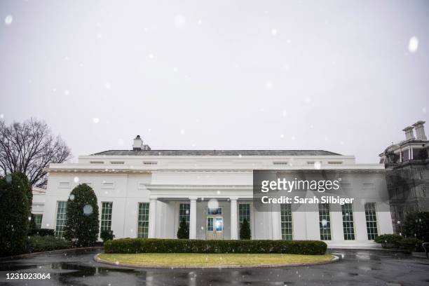 The exterior of the West Wing of the White House is seen during a brief snow storm on Sunday morning on February 7, 2021 in Washington, DC. President...