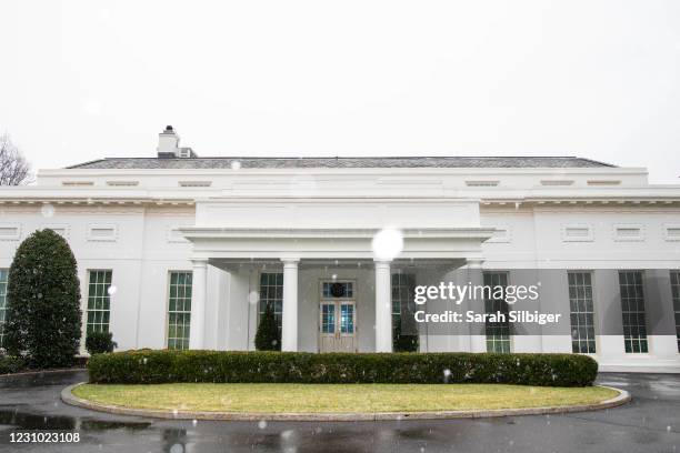 The exterior of the West Wing of the White House is seen during a brief snow storm on Sunday morning on February 7, 2021 in Washington, DC. President...