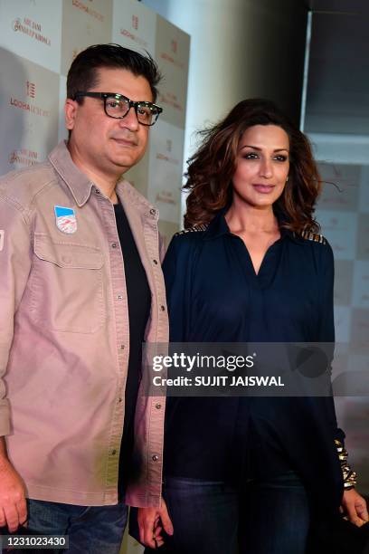 Bollywood actress Sonali Bendre with her husband director Goldie Behl attend an event of Indian fashion designer Abu Jani and Sandeep Khosla in...