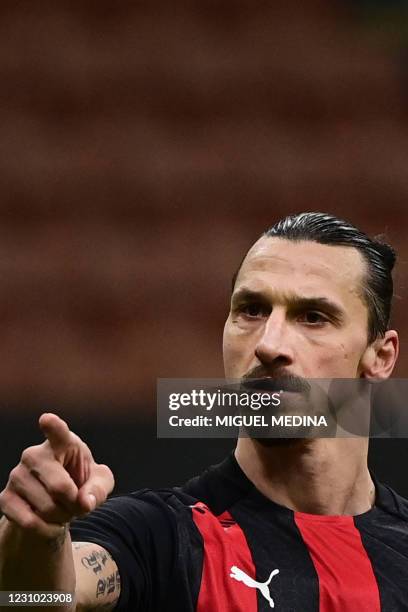 Milan's Swedish forward Zlatan Ibrahimovic celebrates after scoring his second goal during the Italian serie A football match AC Milan vs Crotone on...