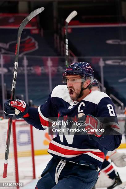 Alex Ovechkin of the Washington Capitals celebrates after scoring a goal against the Philadelphia Flyers in the first period at Capital One Arena on...