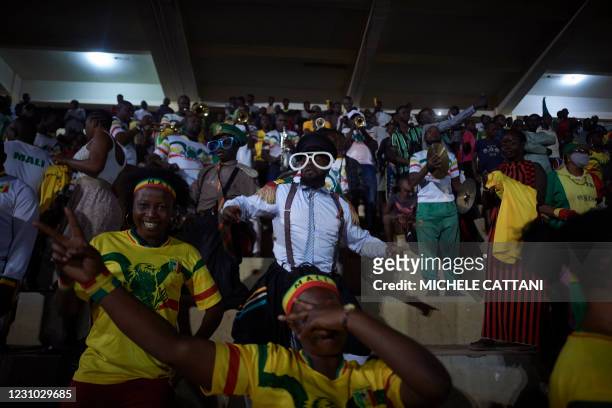 People support the Malian football team during the projection of the final match of the African Nations Championship between Mali and Morocco in the...