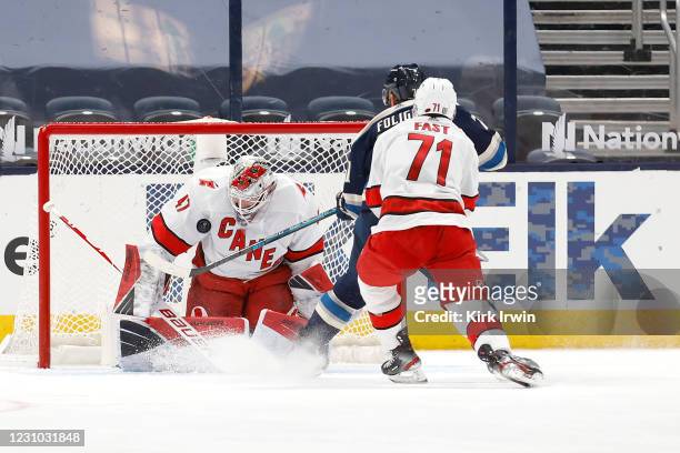 James Reimer of the Carolina Hurricanes blocks a shot by Nick Foligno of the Columbus Blue Jackets during the third period at Nationwide Arena on...