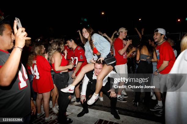 Tampa Bay Buccaneers fans celebrate after Super Bowl LV on February 7, 2021 in Tampa, Florida. Tampa Bay won in dominating fashion 31-9 over...