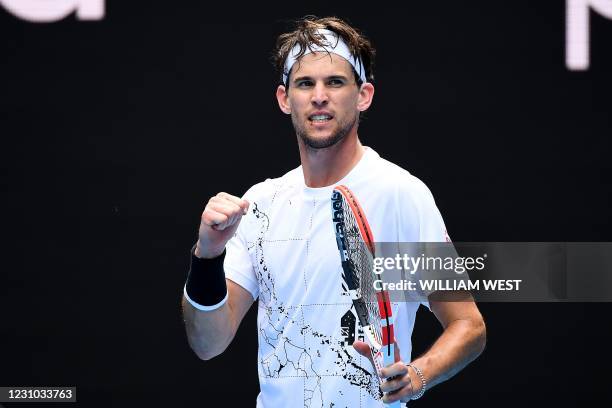 Austria's Dominic Thiem celebrates after winning against Kazakhstan's Mikhail Kukushkin during their men's singles match on day one of the Australian...