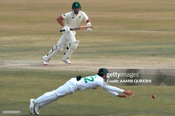 South Africa's Aiden Markram watches the ball after playing a shot as Pakistan's Imran Butt chases the ball during the fifth and final day of the...