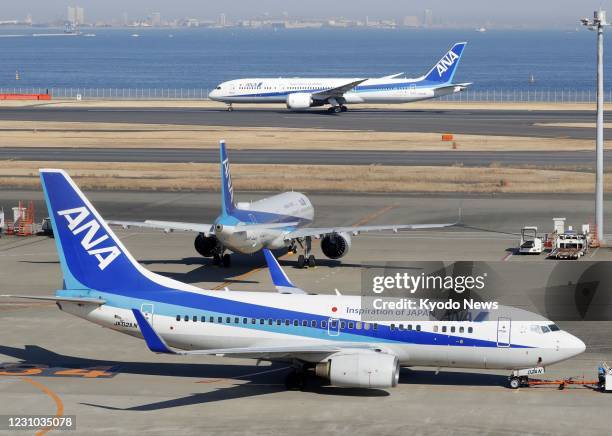 File photo taken Feb. 6 shows aircraft of All Nippon Airways Co. At Haneda airport in Tokyo.