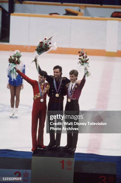 Calgary, Alberta, Canada Brian Orser, Brian Boitano, Viktor Petrenko in medal ceremony for the Men's Free skating event at the 1988 Winter Olympics /...