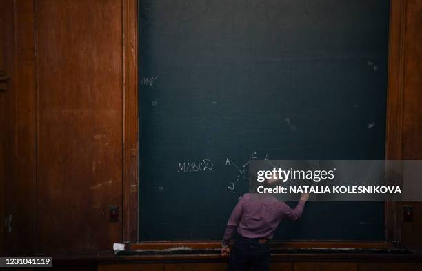 University lecturer leads a lecture at the Moscow State University in Moscow on February 8 as in-person classes resume in Russian universities amid...