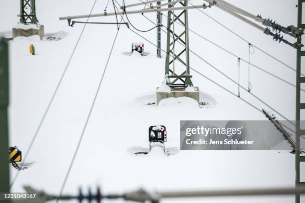 Snow-covered train tracks of the Deutsche Bahn on the second day of a severe snow storm across Germany on February 8, 2021 in Halle, Germany. Heavy...