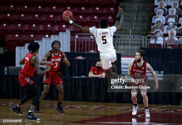 Boston College player Jay Heath loses the ball in the air during game action against N.C. State. The Boston College Eagles men's basketball team...