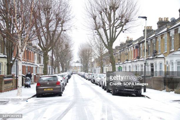 View of a snow covered street in East London following a heavy snowfall caused by Storm Darcy. Heavy snow and ice has brought disruption to parts of...