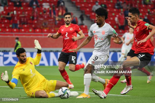 Ahly's goalkeeper Mohamed el-Shenawy dives to make a save from Bayern Munich's French forward Kingsley Coman during the FIFA Club World Cup...