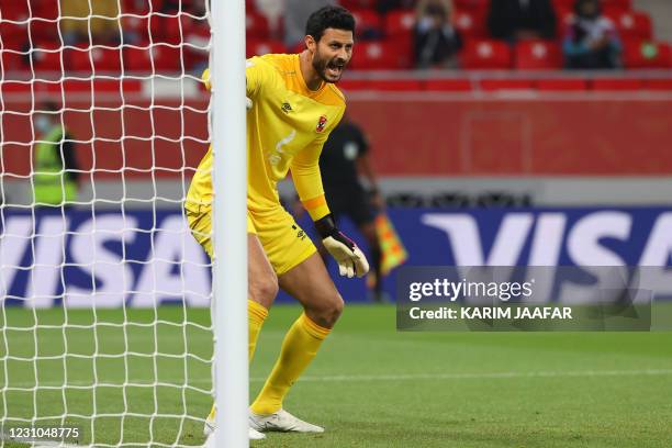 Ahly's goalkeeper Mohamed el-Shenawy speaks to his players during the FIFA Club World Cup semi-final football match between Egypt's Al-Ahly and...