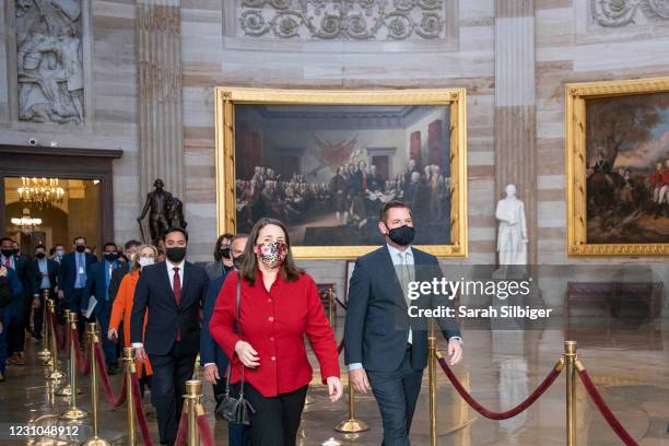 Reps. Diana DeGette and Eric Swalwell lead fellow House Impeachment Managers through the U.S. Capitol Rotunda to the Senate chamber on Monday...