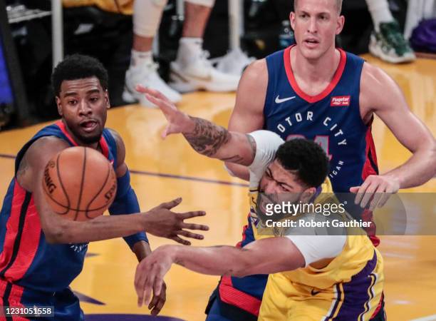 Los Angeles, CA, Saturday, February 6, 2021 - Los Angeles Lakers forward Anthony Davis struggles to pass the ball while being defended by Detroit...
