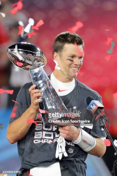 Super Bowl MVP Tom Brady of the Buccaneers holds the Lombardi Trophy after the Super Bowl LV game between the Kansas City Chiefs and the Tampa Bay...