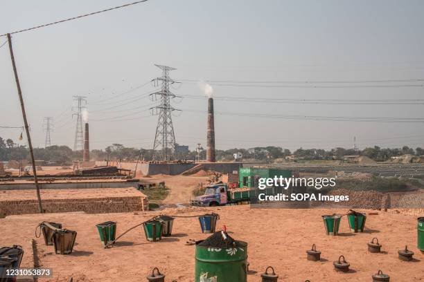 Smoke coming out from kiln towers at a brickfield on the outskirt of Dhaka. A recent reports has concluded that air pollution can shorten life...