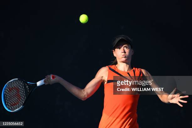 France's Chloe Paquet hits a return against Egypt's Mayar Sherif during their women's singles match on day two of the Australian Open tennis...
