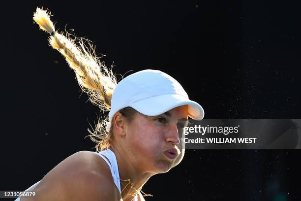 Kazakhstan's Yulia Putintseva serves against Sloane Stephens of the US during their women's singles match on day two of the Australian Open tennis...