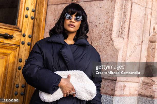 Chili Bendt wearing Hope Stockholm, Cos Stores, and Vagabond shoes poses for a picture outside of Hotel Diplomat on the first day of Stockholm...