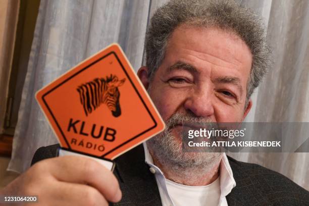 Chairman of the independent Hungarian radio station, the 'Klubradio' Andras Arato shows a Klubradio logo in their headquarters in Budapest on...