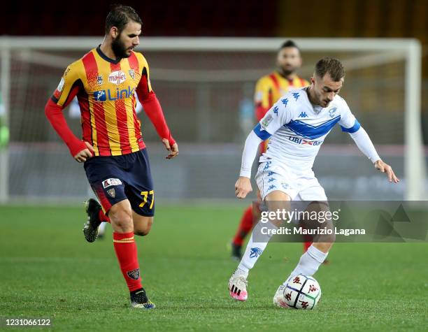 Panagiotis Tachtsidis of Lecce competes for the ball with Alfredo Donnarumma of Brescia during the Serie B match between US Lecce and Brescia Calcio...