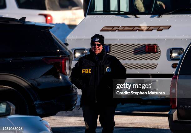 Member of the FBI is seen outside the Allina Health Clinic where a shooting took place earlier today on February 9, 2021 in Buffalo, Minnesota. Five...