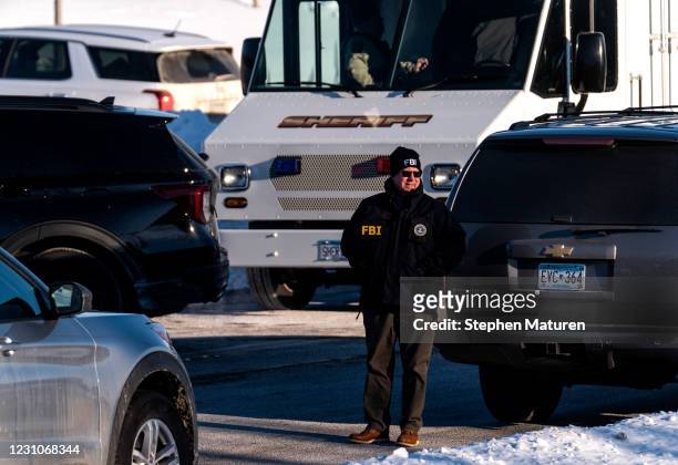 Member of the FBI is seen outside the Allina Health Clinic where a shooting took place earlier today on February 9, 2021 in Buffalo, Minnesota. Five...