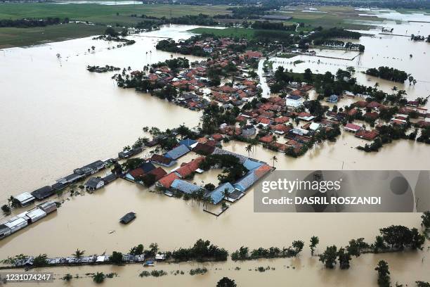 This aerial photo shows a flooded area in Karawang in West Java on February 10 after heavy rains inundated the areas along the Cibeet and Citarum...