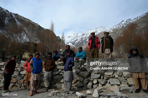 In this picture taken on January 22, 2021 villagers gather in Sadpera village, some 30 Km from Skardu of Gilgit-Baltistan region in northern Pakistan.