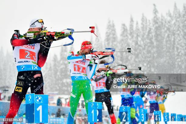 Norway's Sturla Holm Laegreid competes at the shooting range in the 4x7,5 km Mixed Relay event at the IBU Biathlon World Championships in Pokljuka,...